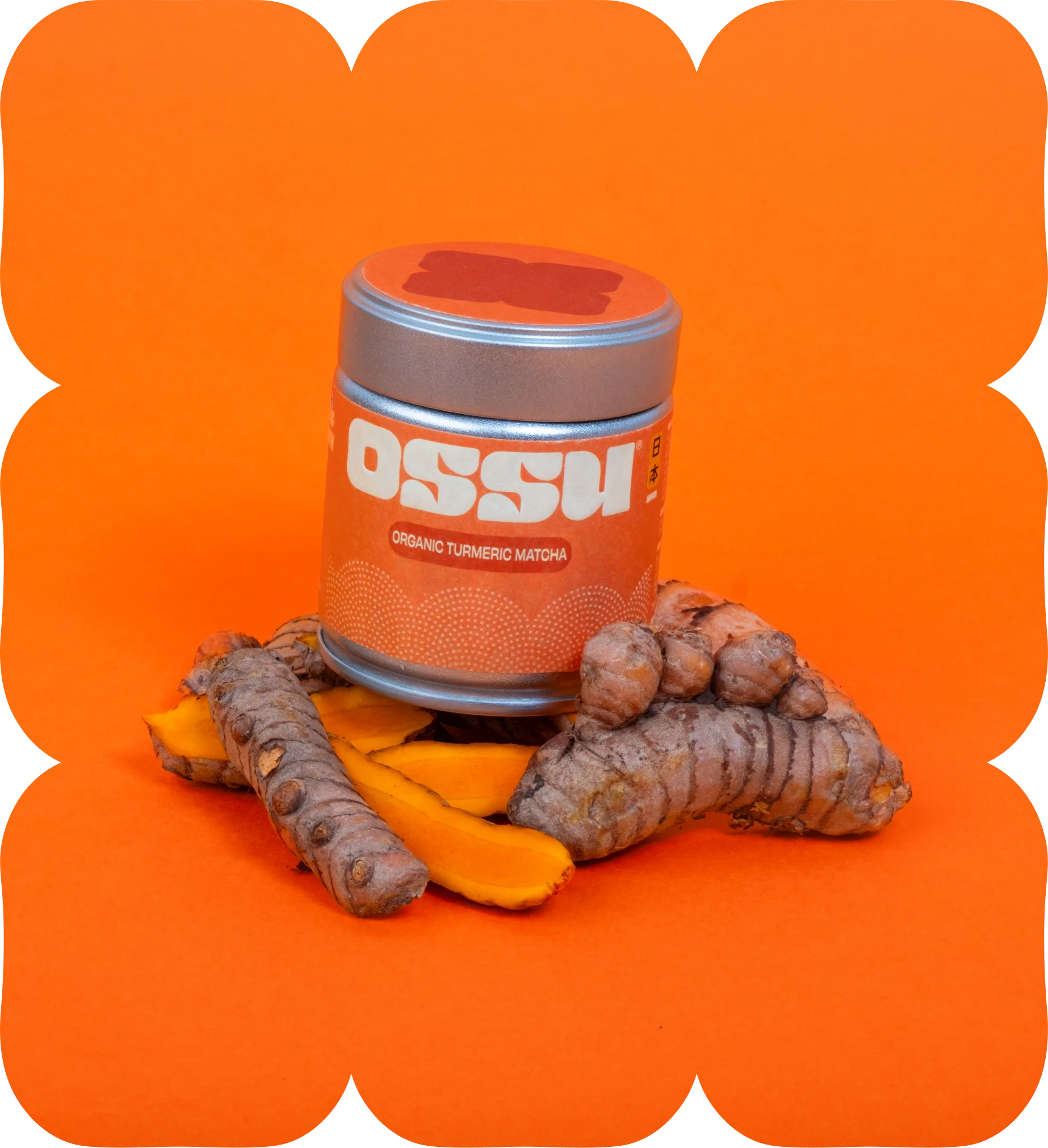 OSSU organic turmeric matcha tin with fresh turmeric root on an orange background